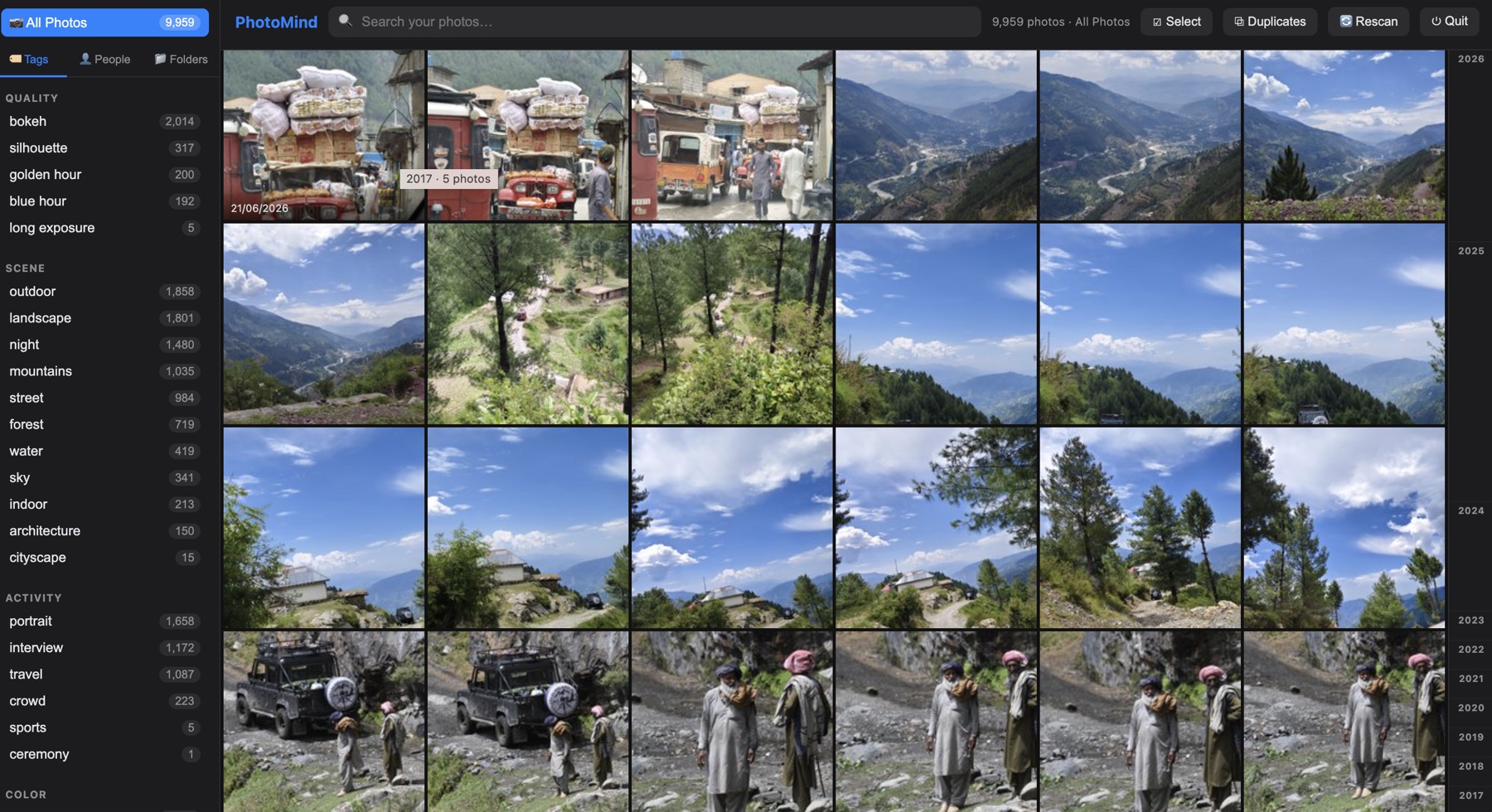 PhotoMind gallery — a full photo library indexed and tagged, browsable by year with quality/scene/activity filters